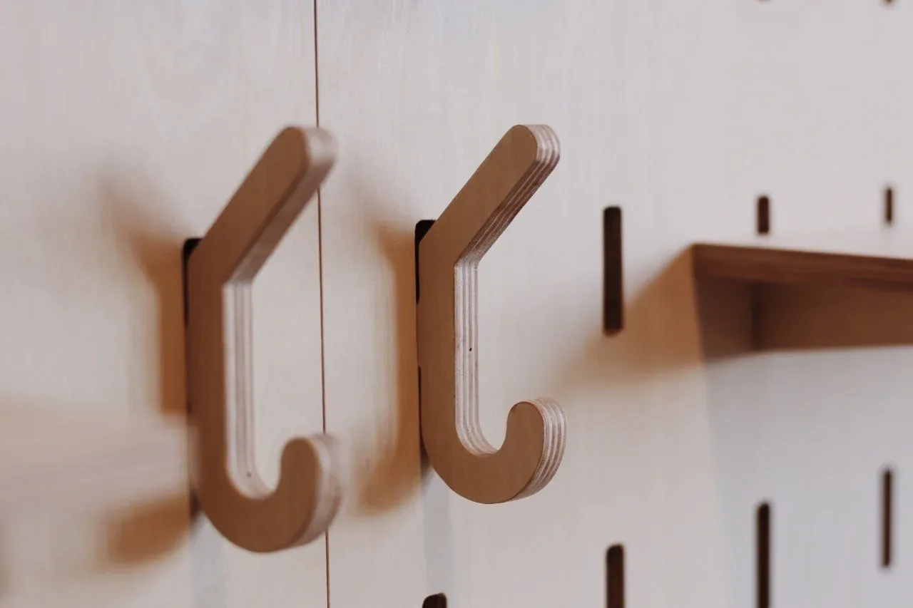 Two plywood hooks on a SNUG pegboard